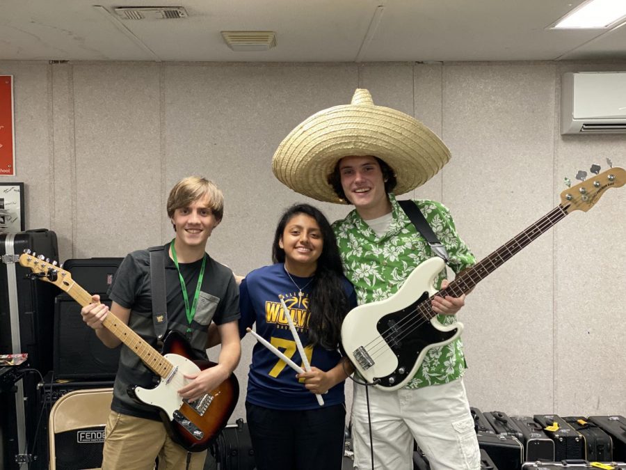 Michael Anzivino, Padraig Mee, and Amy Guzman attend Rock Band practice.